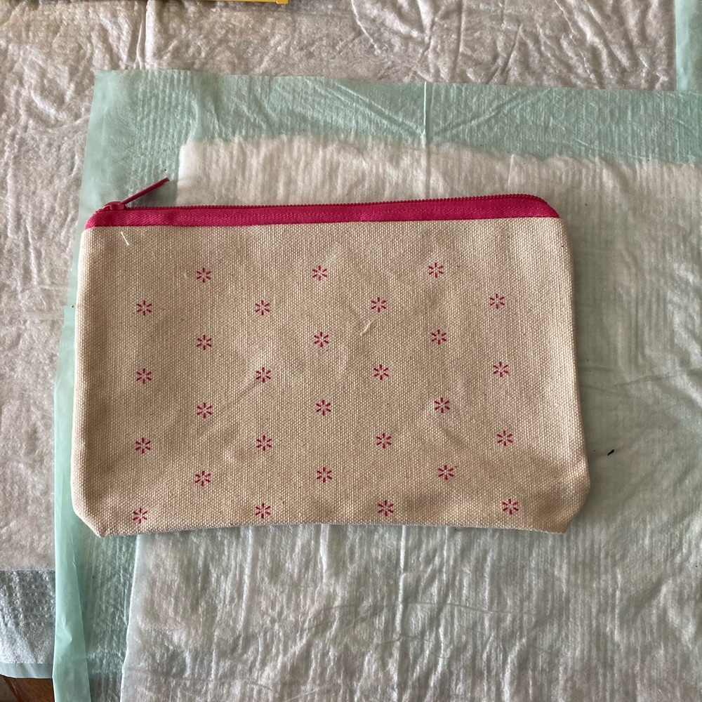 Ipsy cream and pink makeup bag